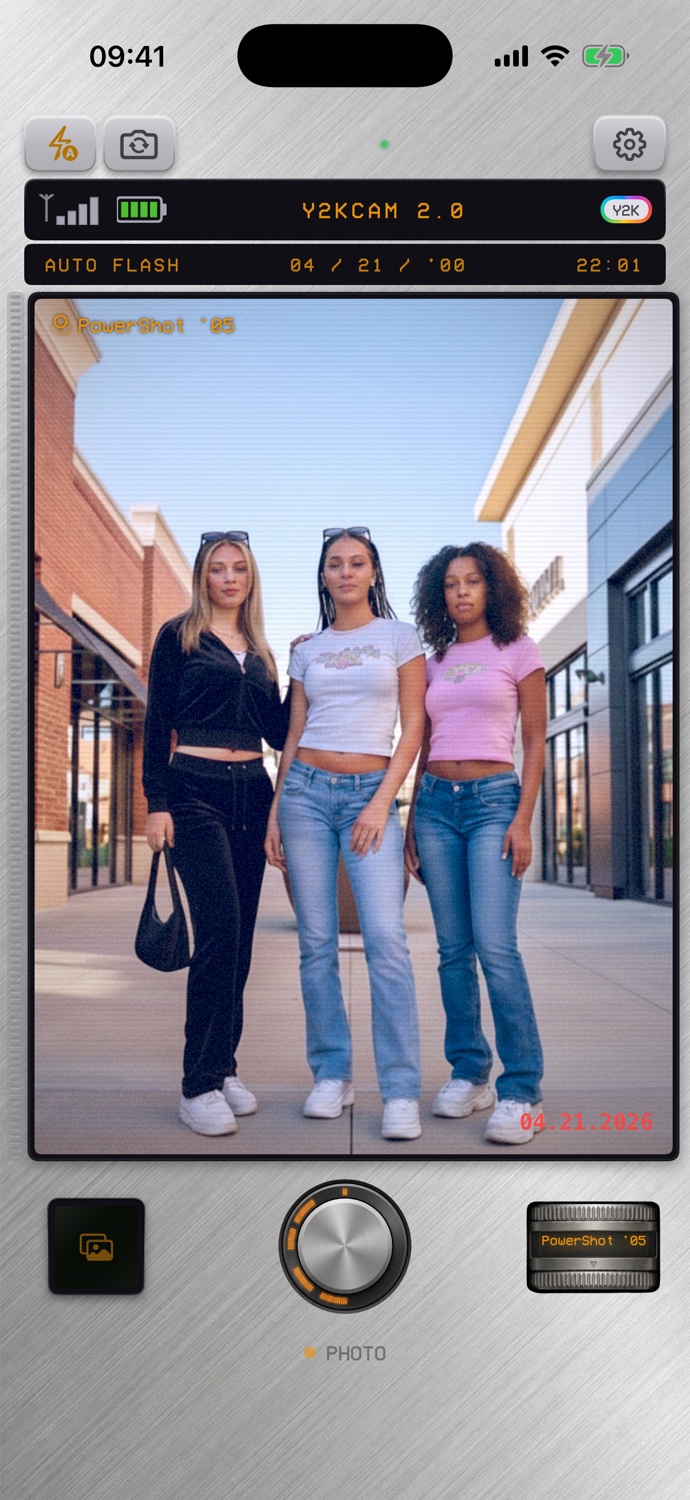Y2KCam viewfinder showing three friends in Y2K outfits with the digicam UI overlay